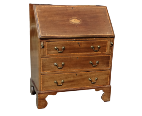 A George III style mahogany bureau - the fall with satinwood banding and shell inlay enclosing a fitted interior, with an arr