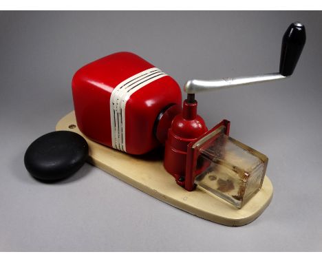 A vintage Kym &amp; Kym wall mounted coffee grinder - with a red ceramic bean hopper and clear glass collector, height 32cm.