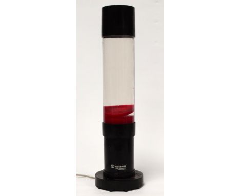 A Mathmos lava lamp - red 'lava' with black fittings, height 40cm.