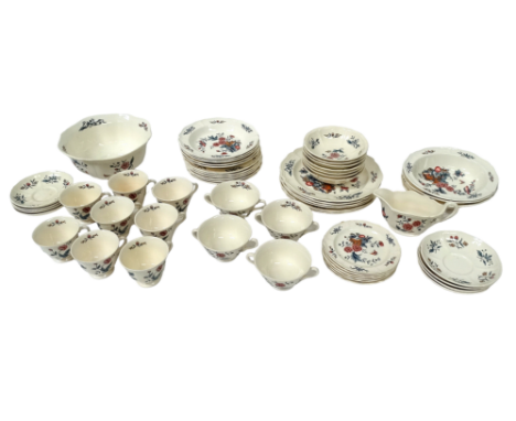 A Wedgwood 'Williamsburg' pattern dinner service - principally six place settings, including dinner plates, salad plates, sid