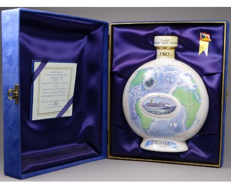 A limited edition P &amp; O Cruises bottle of cognac - the ceramic decanter with images of shipping and the globe, within a p