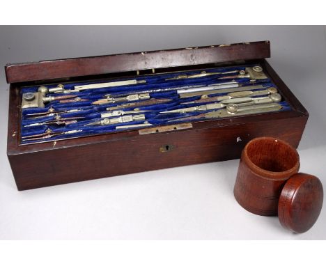 A late 19th century rosewood boxed set of drawing instruments - the comprehensive set by W. Watson &amp; Son of High Holborn 