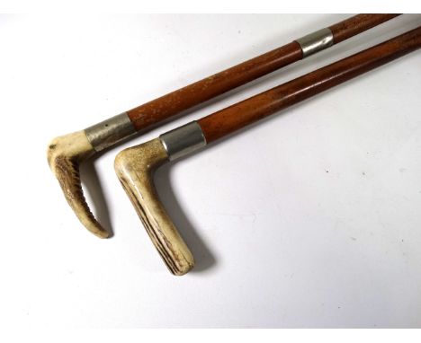 A horn handled walking stick - with white metal mount, together with a similar riding crop.