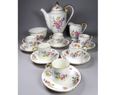 A Royal Worcester tea service of one - decorated with roses with gilt borders, together with a coffee service for four settin