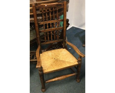 A Georgian oak stick back chair.