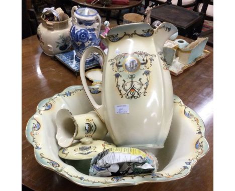 A decorative pottery jug and basin set.