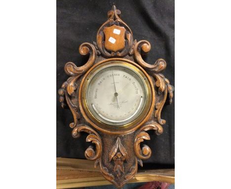 A Victorian mahogany wall mounted barometer.