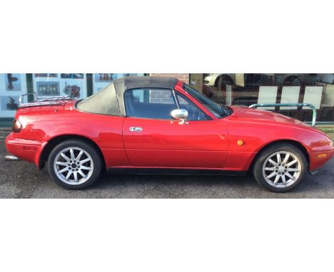 A Mazda MX-5 Roadster Enous Manual convertible car in red. PETROL. 1600 cc. 1998. Approx. 174,170 miles. Registration G481 CL