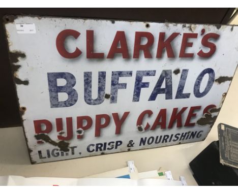 An original 'Clark's Buffalo Puppy Cakes' enamel sign