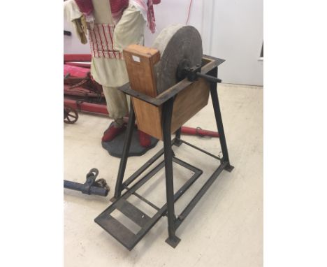 A vintage treadle grinder