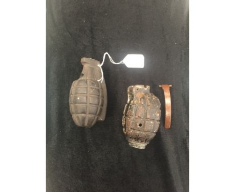 A British Mills rifle grenade and US Army practice dummy pineapple grenade