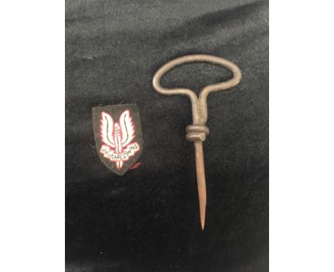 An SAS beret patch and push knife
