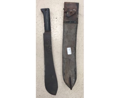 A WWII original British jungle machete in leather scabbard