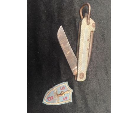 An SBS beret cloth patch and named lock knife