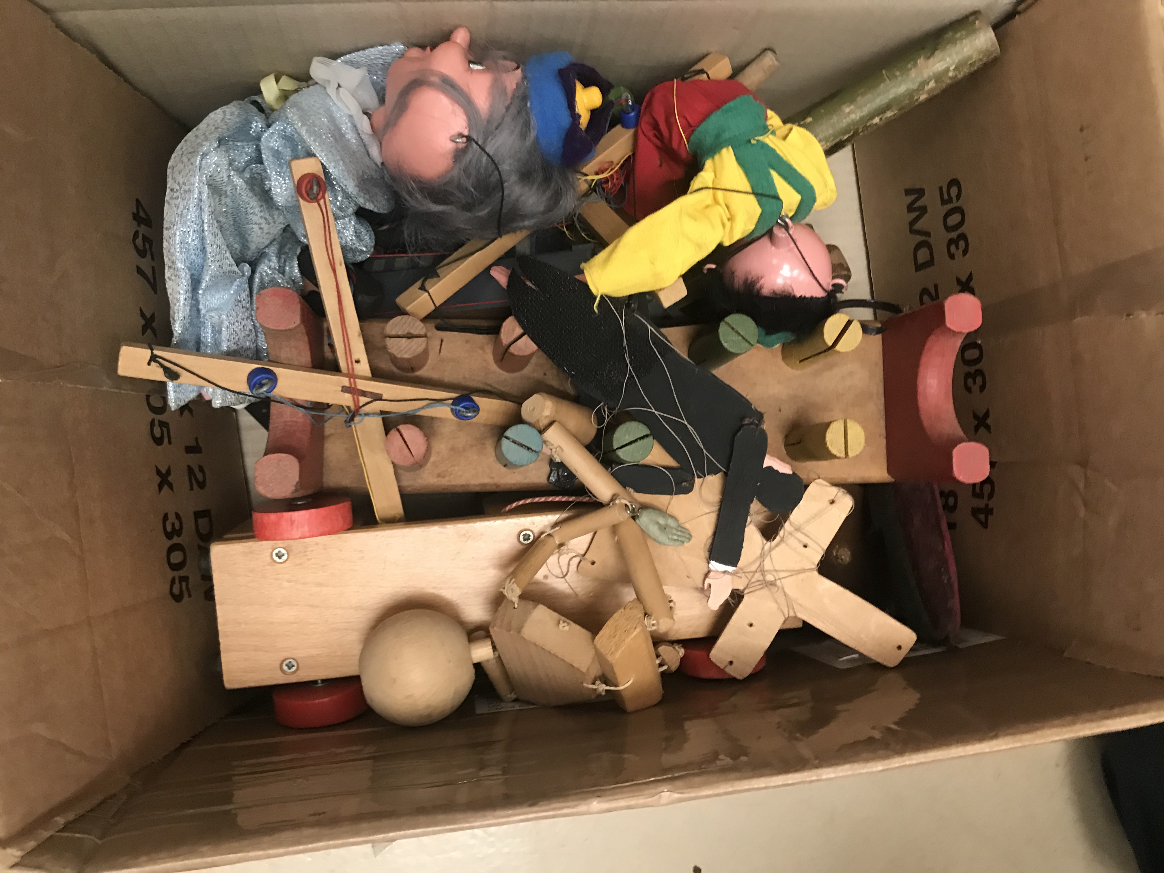 A box of antique wooden toys and two Pelham puppets
