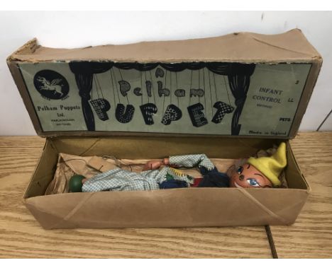 An early 1940's boxed Pelham clown puppet