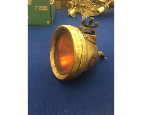 An antique brass Lucas car lamp