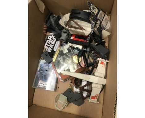 A box of varied Star Wars toy item spares etc