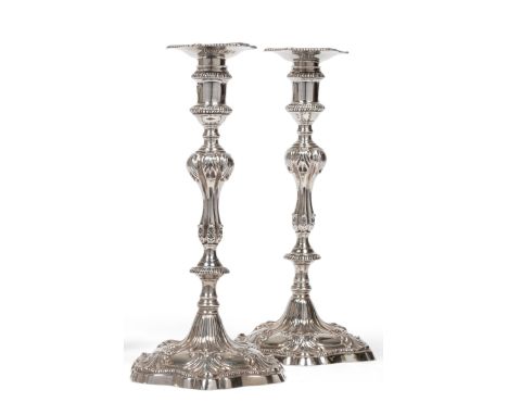 A Pair of George III Cast Silver Candlesticks, maker's mark I.C, possibly John Carter II, London 1774, the shaped hexagonal b