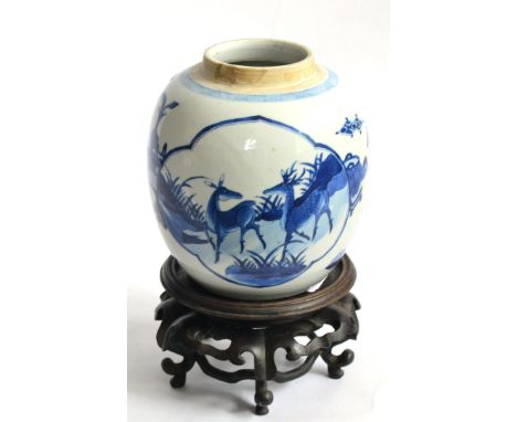 A Chinese Blue and White Jar, Kangxi (1662-1722), compressed ovoid, painted with two quatrefoil panels, one with a pair of de