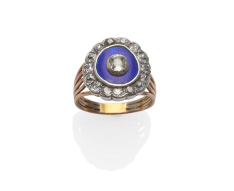 A Mourning Ring, an old cut diamond centres a blue enamel frame, with an outer border of smaller old cut diamonds, in white c