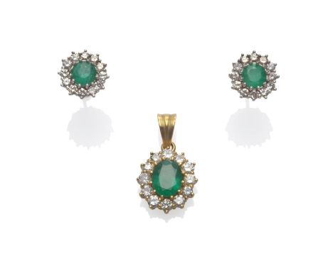 An Emerald and Diamond Cluster Pendant, an oval cut emerald within a border of round brilliant cut diamonds in yellow claw se