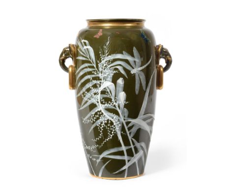 A Minton Pate-sur-Pate Vase, by Frederick A Rhead, circa 1875, of ovoid form, with double elephant head and ring handles, fin