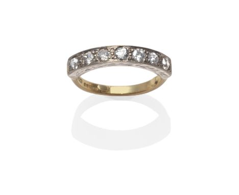 An 18 Carat Gold Diamond Half Hoop Ring, seven old cut diamonds in white claw settings, on a decorative mount, to a yellow pl