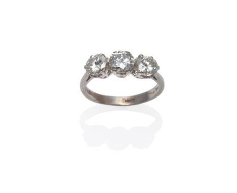 A Diamond Three Stone Ring, round brilliant cut diamonds in white claw settings, to a tapered shoulder plain polished shank, 