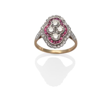 An Art Deco Style Ruby and Diamond Cluster Ring, set with four old cut diamonds within a border of calibré cut rubies and an 