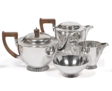 A George VI Silver Four Piece Tea Service, Wakely & Wheeler, London 1943, comprising hot water jug (lacking knop), teapot, cr