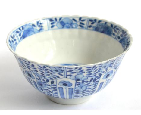 A Chinese Blue and White Bowl, of ribbed U shape, decorated in underglaze blue with panels of stylised flowers and foliage, t