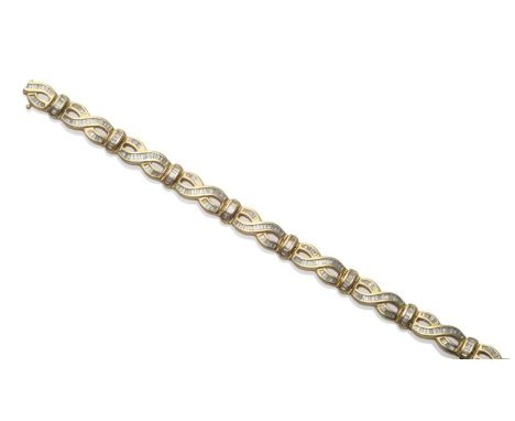 A Diamond Set Bracelet, with figure-of-eight style links, inset with baguette cut diamonds, in yellow channels, total estimat