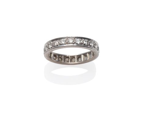 A Diamond Eternity Ring, round brilliant cut diamonds in white claw settings, to a flat sided shank, total estimated diamond 