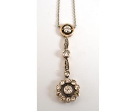 An Early 20th Century Diamond Pendant, the drop comprising old brilliant cut and rose cut diamonds in white claw and millegra