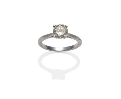 An 18 Carat White Gold Diamond Solitaire Ring, a round brilliant cut diamond in a white four claw setting, to a tapered shoul