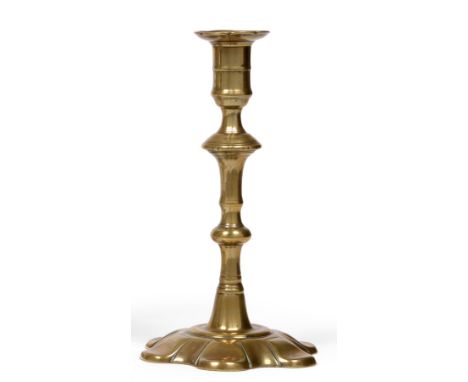 A Group of 18th Century Candlesticks, circa 1750, with shaped or domed based and knopped stems; and A French Iron Spiral Cand