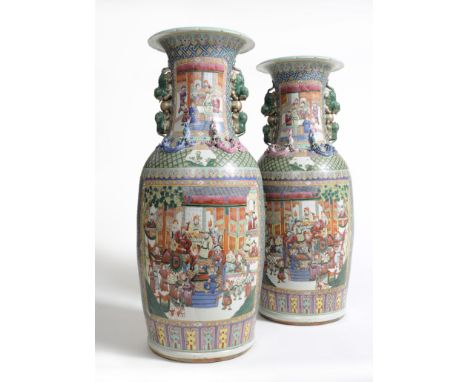 A Large Pair of Chinese Porcelain Baluster Vases, 20th century, each with notched everted rims and pairs of cavorting fo dogs