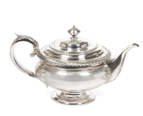 A George IV Scottish Silver Teapot, Charles Bendy, Edinburgh 1821, of compressed melon form with a gadrooned border and acant