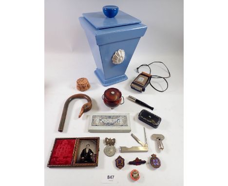 A box of collectables including duck umbrella handle, snuff box, badges etc