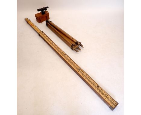 A Hallbro theodolite, tripod and ranging staff