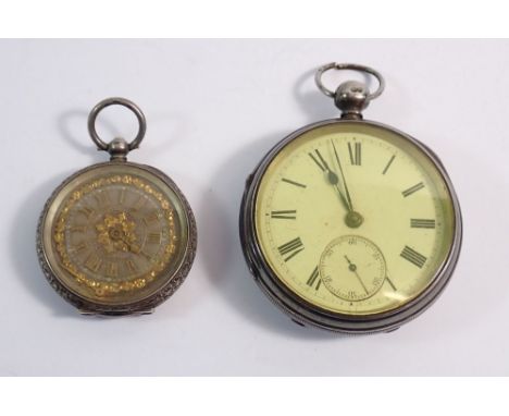 A Victorian silver pocket watch, London 1877 and a 935 silver fob watch with engraved decoration
