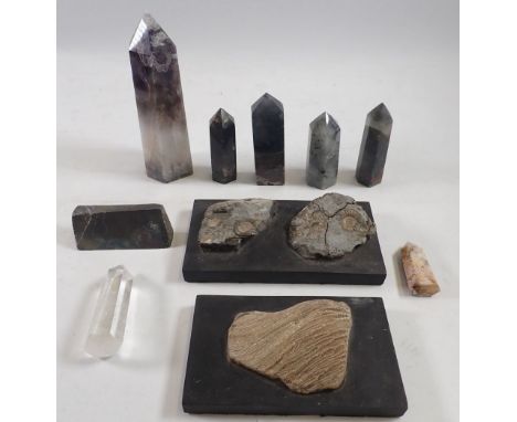 Two mounted stone fossils and various stone obelisks and specimens, amethyst obelisk 15cm tall