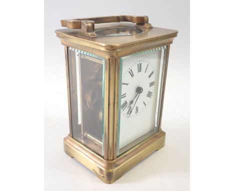 A French 8 day brass carriage clock with enamelled dial, 11cm tall