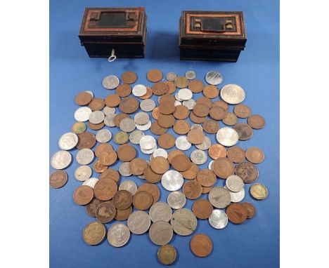 Two small cash tins containing various British and World coins including Victoria silver sixpence and threepence, Churchill c