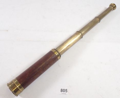 An antique wood and brass three draw telescope, 42cm extended