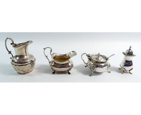 A silver salt and jug by Goldsmiths &amp; Silversmiths plus another jug and pepper pot, various dates, 120g