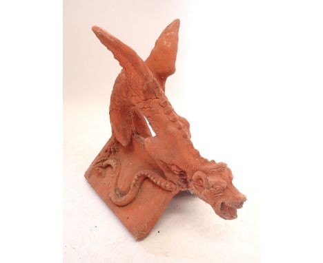 A Thai terracotta dragon form roof tile, 44cm tall
