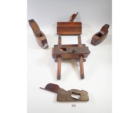 A group of five antique woodworking planes and moulding tools, some marked