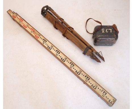 A surveyors dumpy level with ranging staff and tripod 